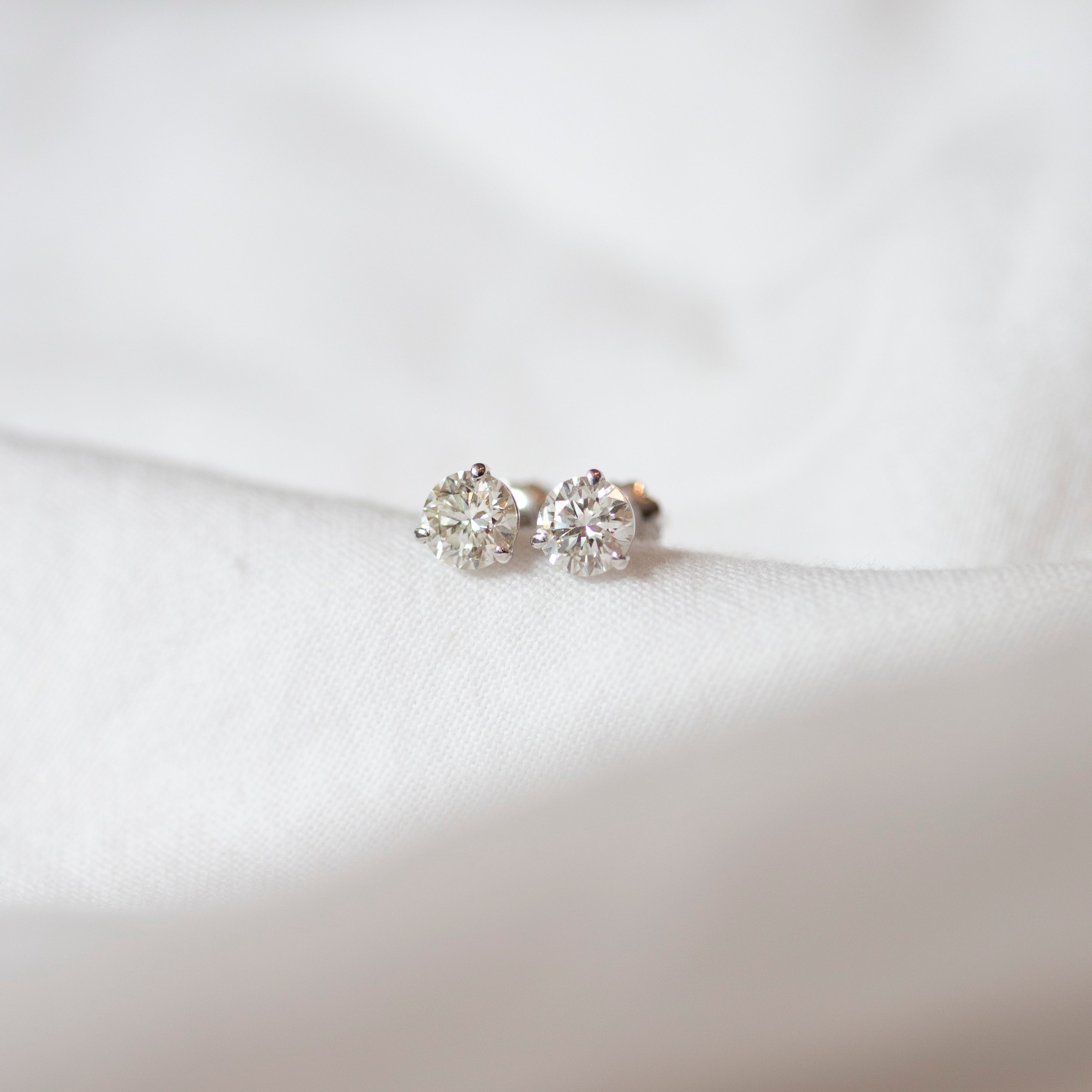 Enhance your elegance with these exquisite 14Kt gold lab diamond earrings, featuring a mesmerizing 1 Ct. TW. Martini set for a touch of sophistication. A must-have staple for every occasion.