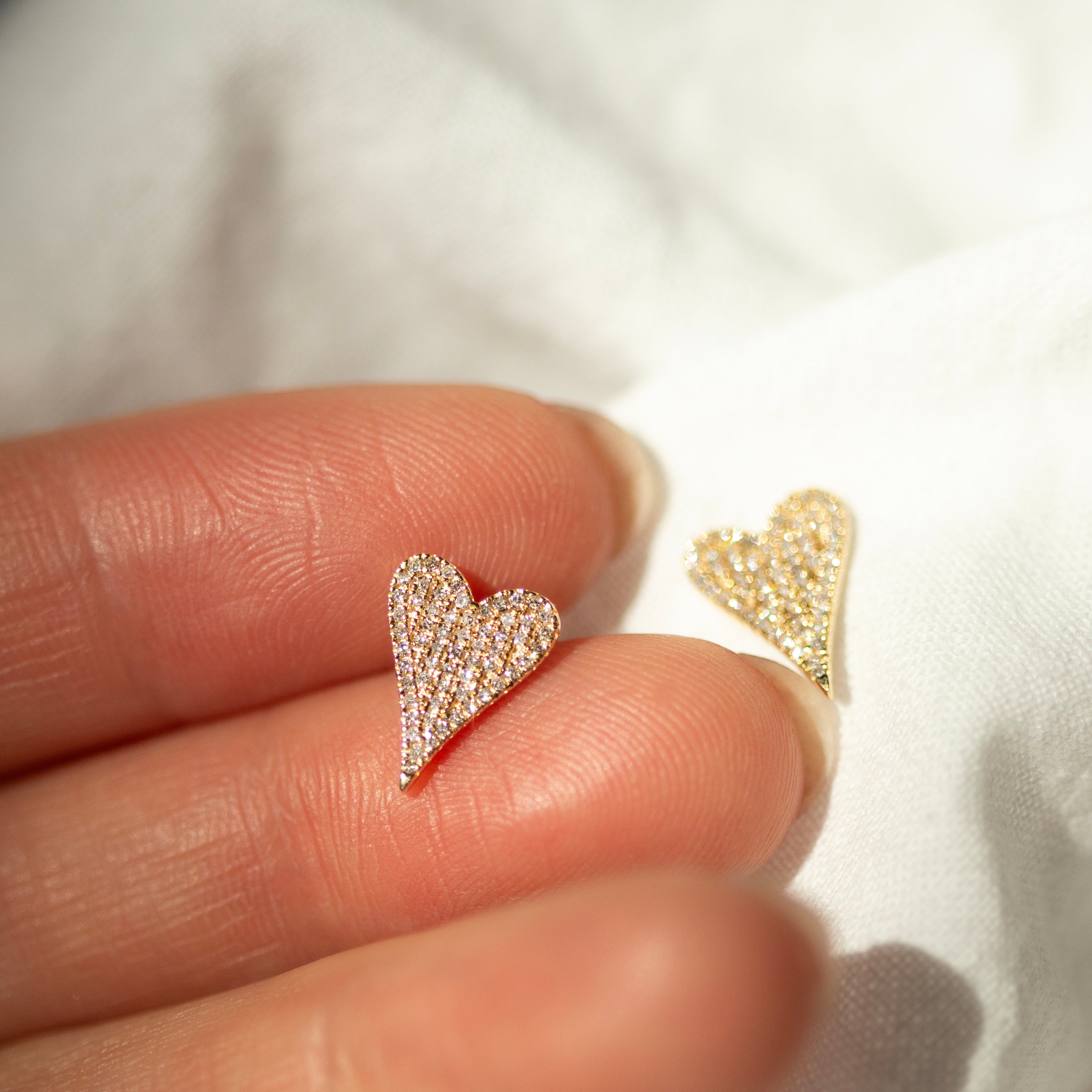 Small Pave Diamond Heart Earrings
Elevate your style with these elegant 14K Small Pave Diamond Heart Earrings. Exquisitely crafted with small pave diamonds for a subtle yet, luxurious look. These earrings make a perfect gift or an exquisite addition to your own collection. Be sure to sparkle and shine with these exquisite heart-shaped delights.