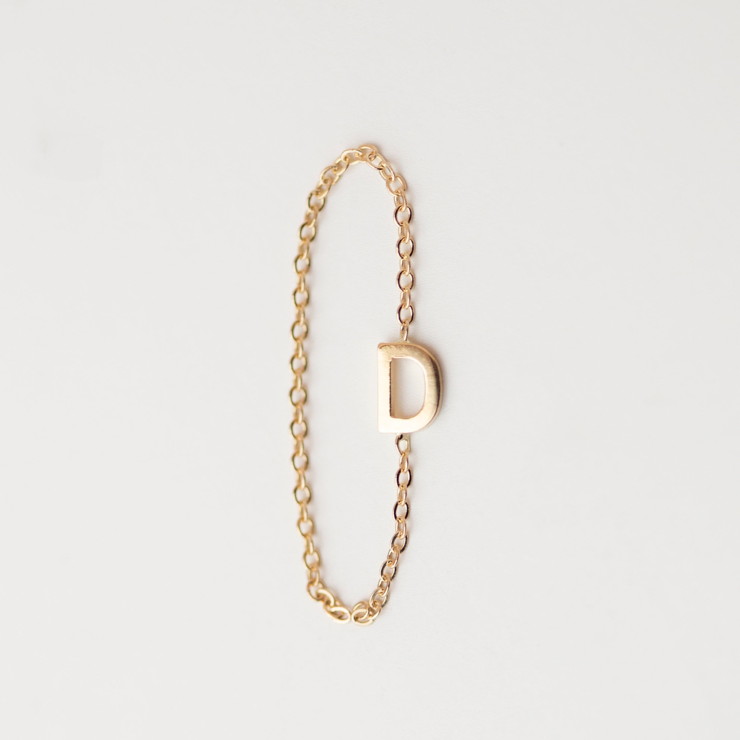 Elegant 14K Monogram Ring: A subtle, dainty 14k gold ring featuring a small monogram for a modern and timeless touch. Luxurious and sophisticated, this delicate chain ring exudes exclusivity.
Simple, minimalist everyday Initial Ring - Perfect as a stacking ring or by itself.