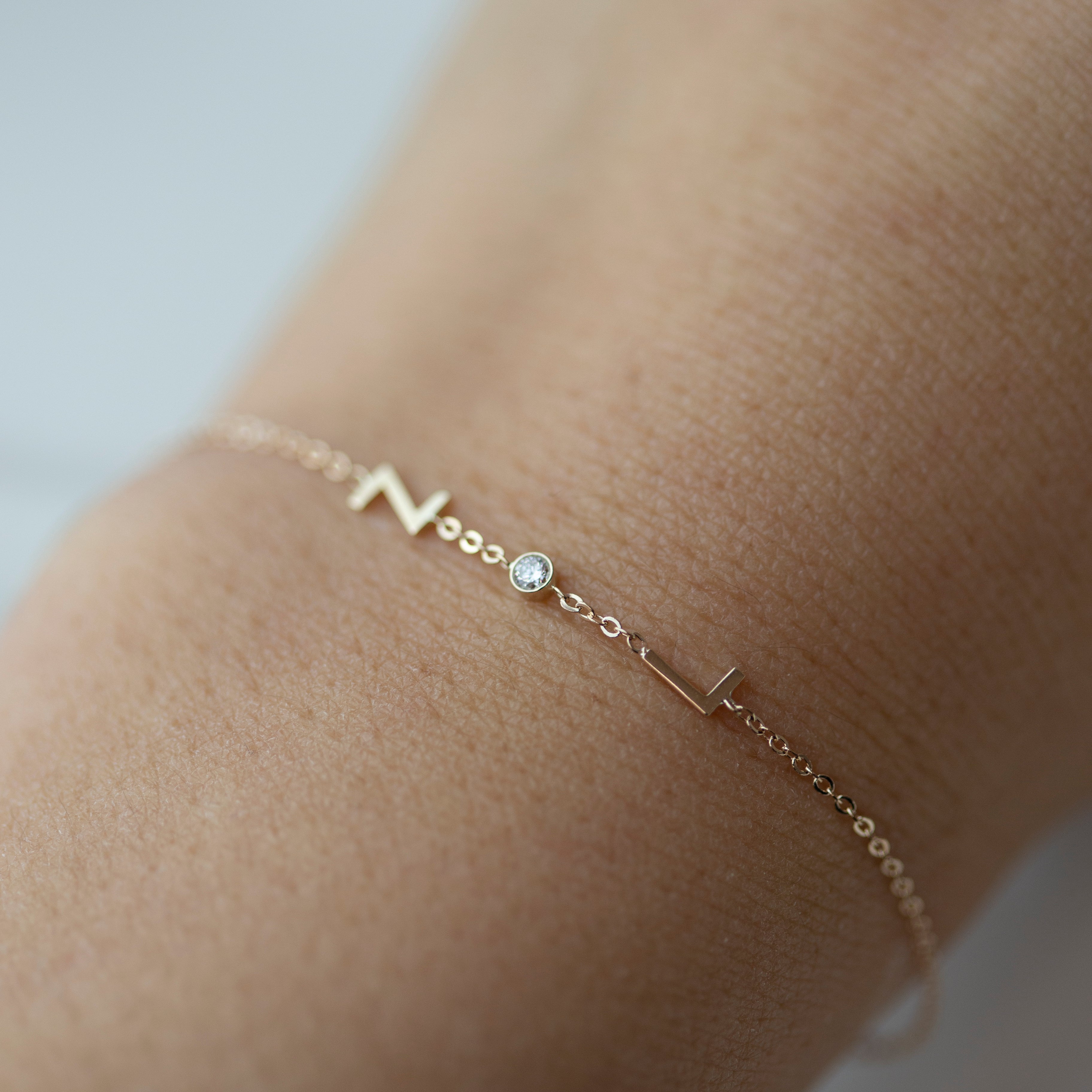 Personalized 14k solid gold initials bracelet with genuine diamond.
Simple, minimalist everyday bracelet with a little sparkle
Perfect wearing alone or layering with your favorite bracelets.