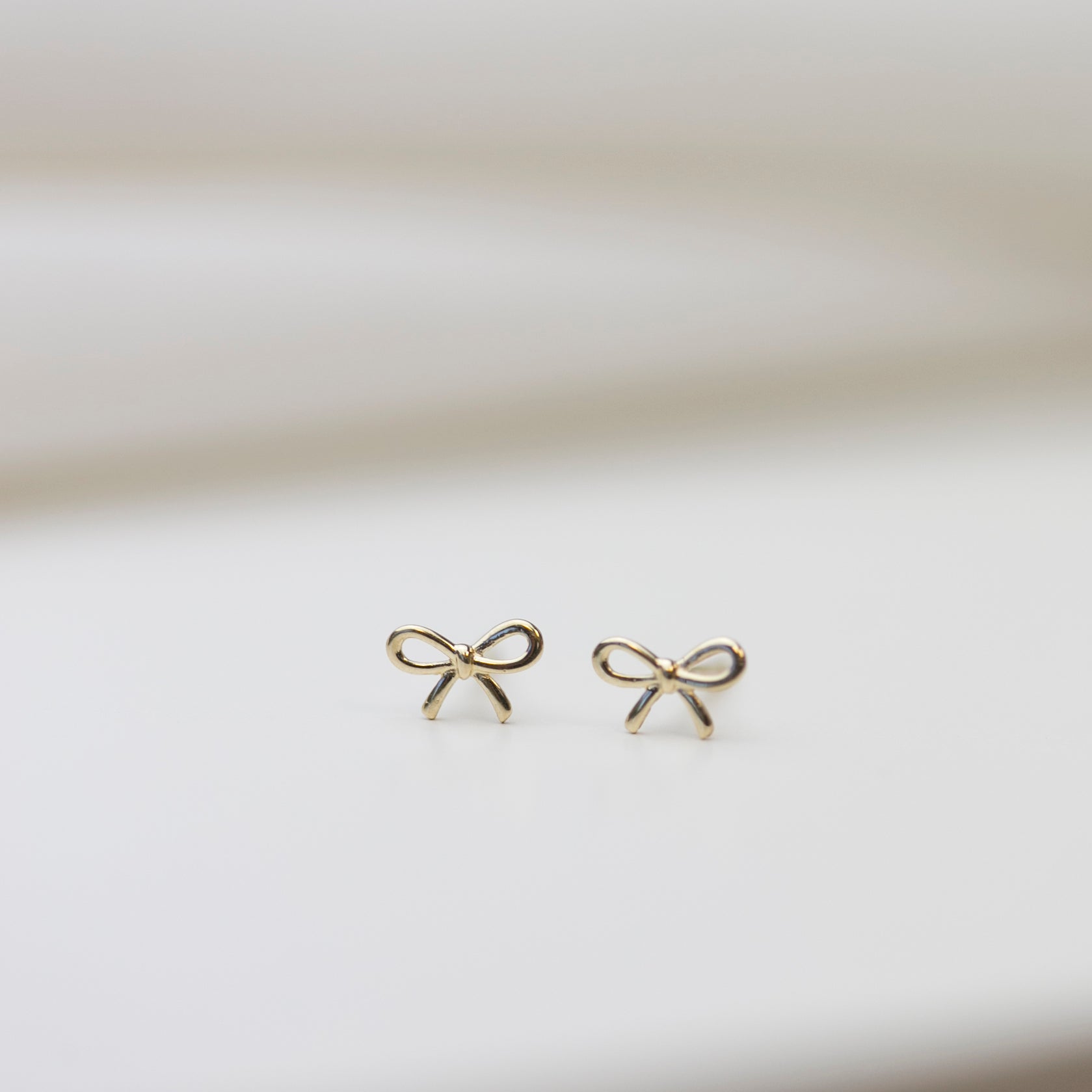 14k gold bow earrings