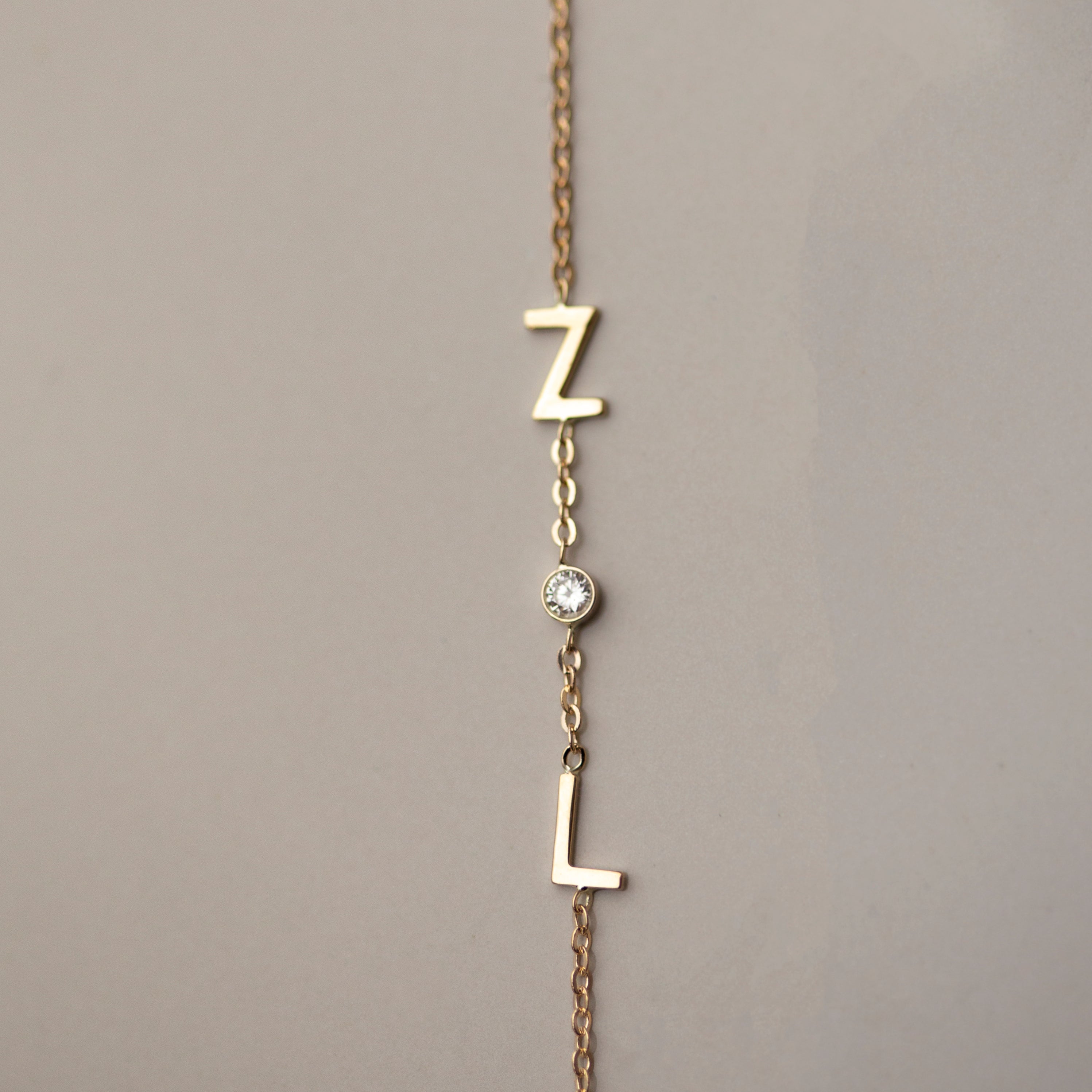 Personalized 14k solid gold initials bracelet with genuine diamond.