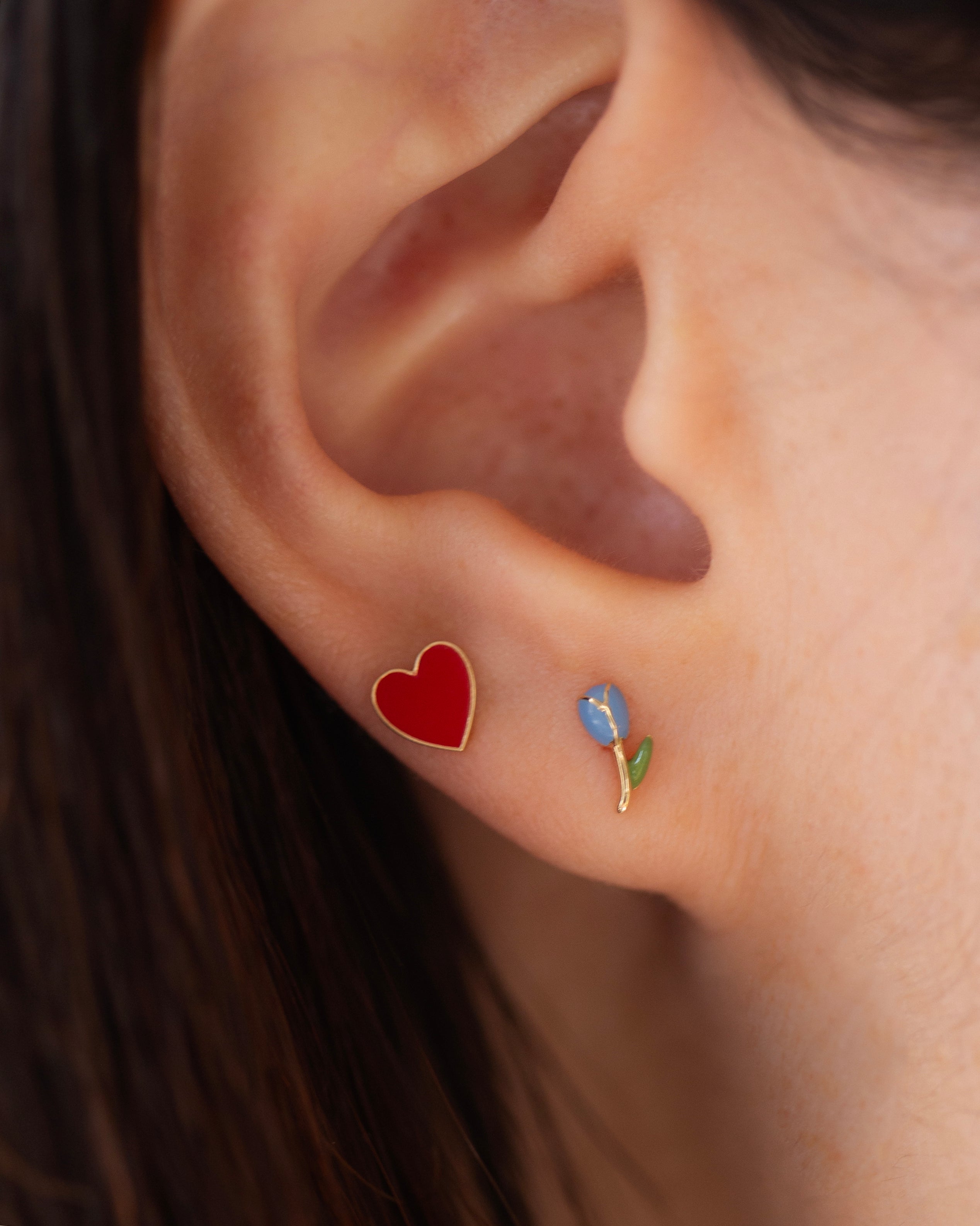 Celebrate love with these red enamel heart stud earrings! The perfect gift for your Valentine or yourself! These red enamel heart stud earrings are the perfect accessory to celebrate love. With their vibrant color and delicate design, they make a thoughtful gift for your Valentine or a special treat for yourself. Add a touch of love to any outfit with these beautiful earrings.