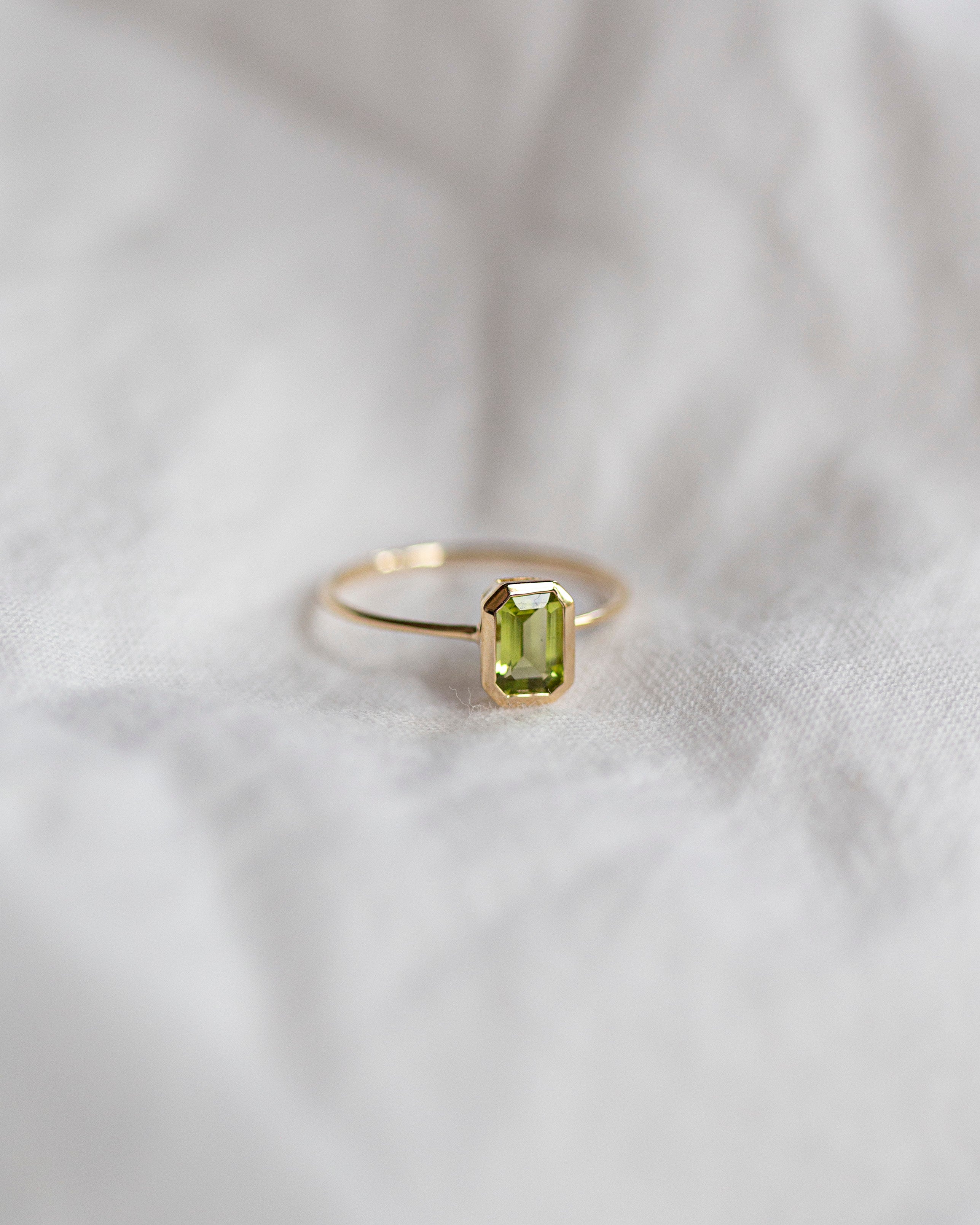 The octagon-shaped peridot on this ring is both eye-catching and elegantly simplistic. It is the perfect way to celebrate a special August birthday or simply adorn oneself with its stunning light green hue.