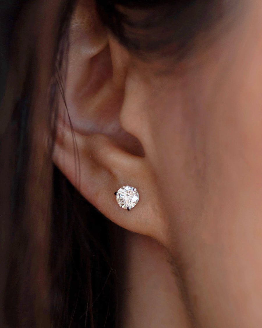 Enhance your elegance with these exquisite 14Kt gold lab diamond earrings, featuring a mesmerizing 1 Ct. TW. Martini set for a touch of sophistication. A must-have staple for every occasion.