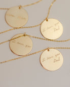  Each pendant has a handwritten message. The messages are 'I love you Dad', 'I love you Dad', 'I love you', and 'Love Mom'.