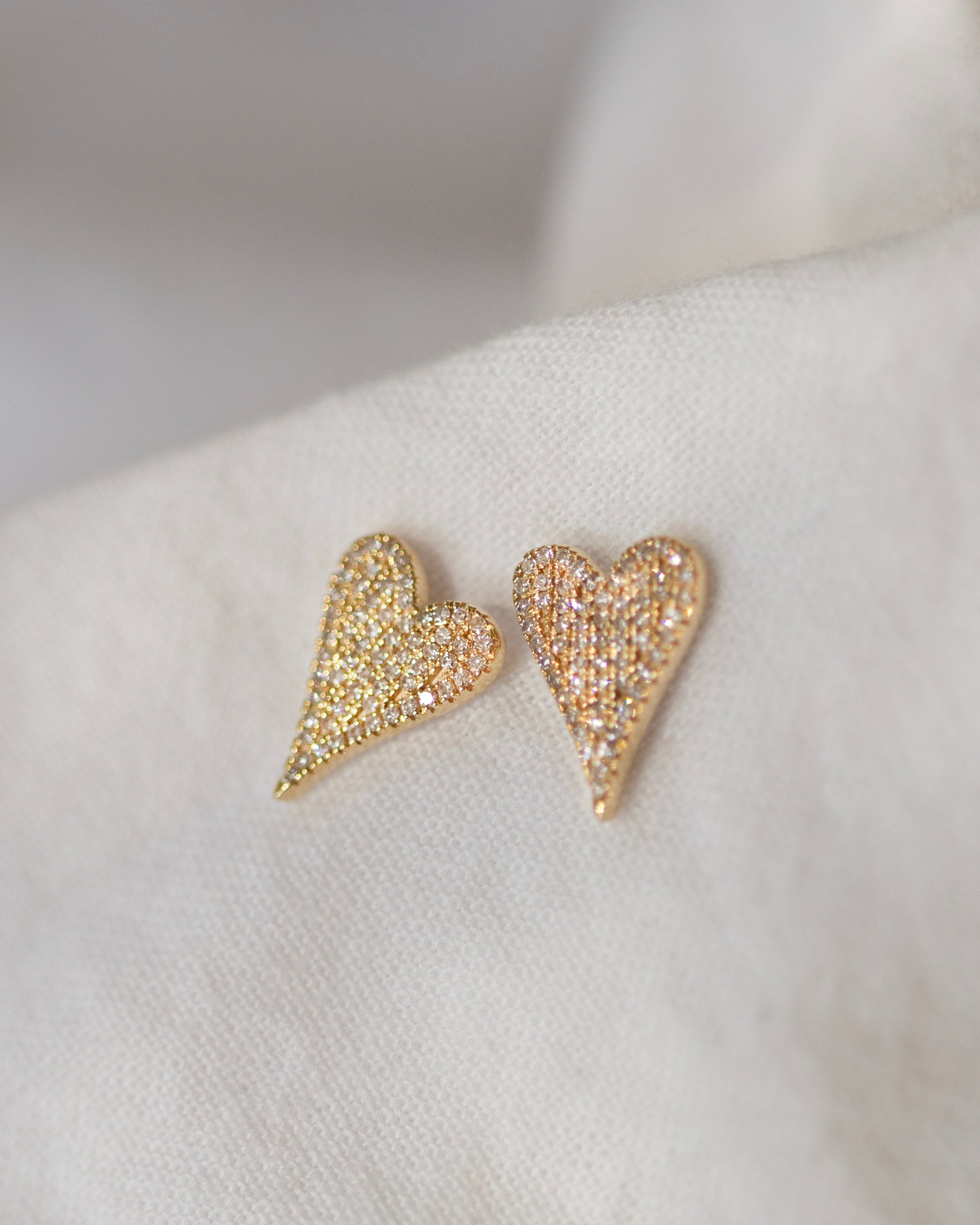 Small Pave Diamond Heart Earrings

Elevate your style with these elegant 14K Small Pave Diamond Heart Earrings. Exquisitely crafted with small pave diamonds for a subtle yet, luxurious look. These earrings make a perfect gift or an exquisite addition to your own collection. Be sure to sparkle and shine with these exquisite heart-shaped delights.