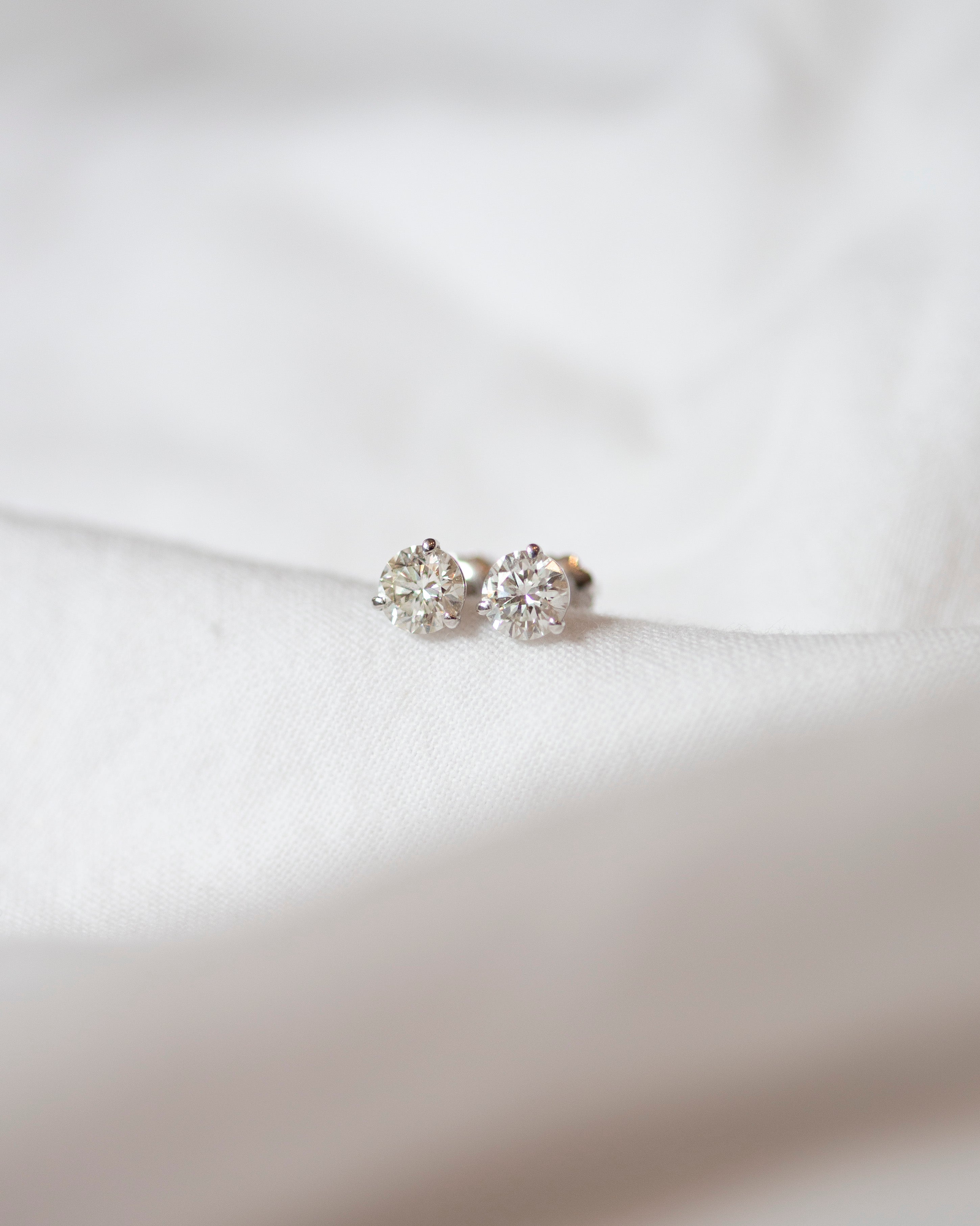 Enhance your elegance with these exquisite 14Kt gold lab diamond earrings, featuring a mesmerizing 1 Ct. TW. Martini set for a touch of sophistication. A must-have staple for every occasion.
