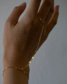 This exquisite and delicate hand chain with lace chain is a stylish, effortlessly elegant way to elevate your look. Perfect for layering and creating a boho aesthetic, this understated bracelet is also available in sterling silver. Make a statement with this tasteful and luxurious accessory for a timelessly sophisticated finish.