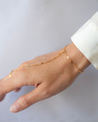 This exquisite and delicate hand chain with lace chain is a stylish, effortlessly elegant way to elevate your look. Perfect for layering and creating a boho aesthetic, this understated bracelet is also available in sterling silver. Make a statement with this tasteful and luxurious accessory for a timelessly sophisticated finish.