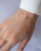 This exquisite and delicate hand chain with lace chain is a stylish, effortlessly elegant way to elevate your look. Perfect for layering and creating a boho aesthetic, this understated bracelet is also available in sterling silver. Make a statement with this tasteful and luxurious accessory for a timelessly sophisticated finish.