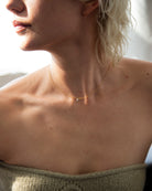 14k Gold chain with beautiful diamond in a drilled jump ring setting
This gorgeous minimalist diamond solitaire necklace features a .1ct round brilliant diamond on a dainty chain as if the diamond was naked.