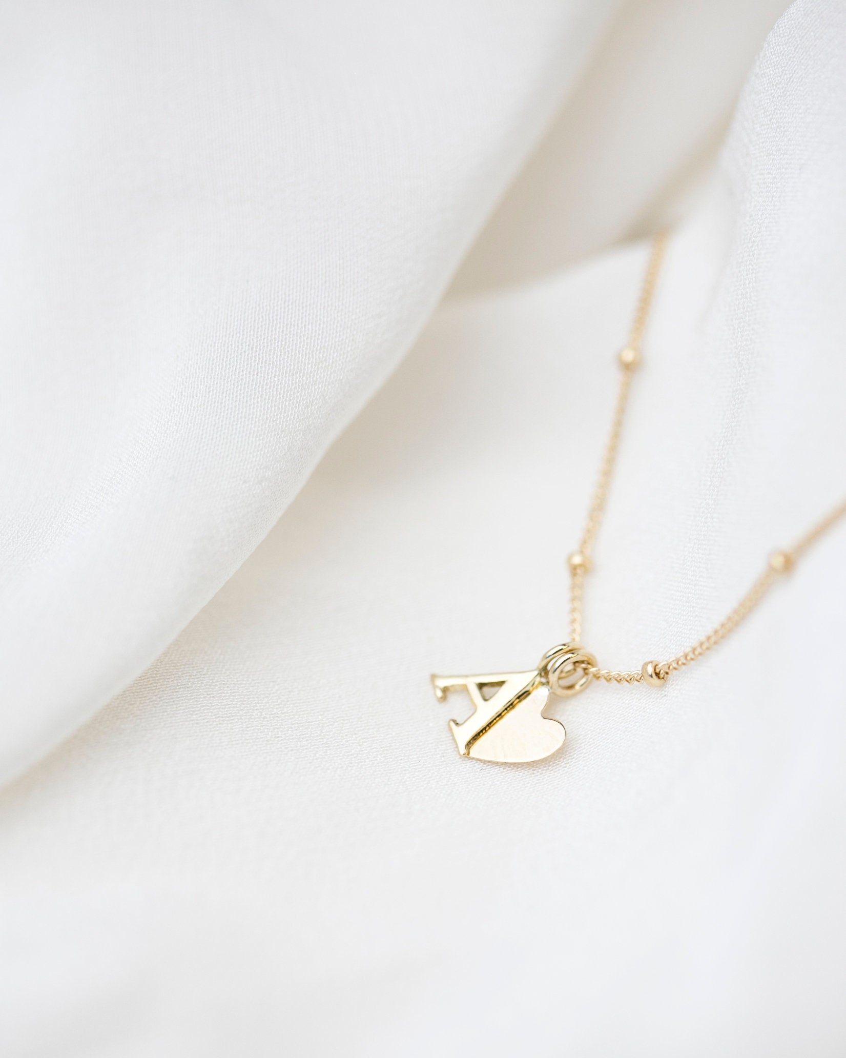 Personalized 14k solid gold initials necklace with beautiful beaded chain.Simple, minimalist everyday necklace.
Perfect wearing alone or layering with your favorite necklaces.