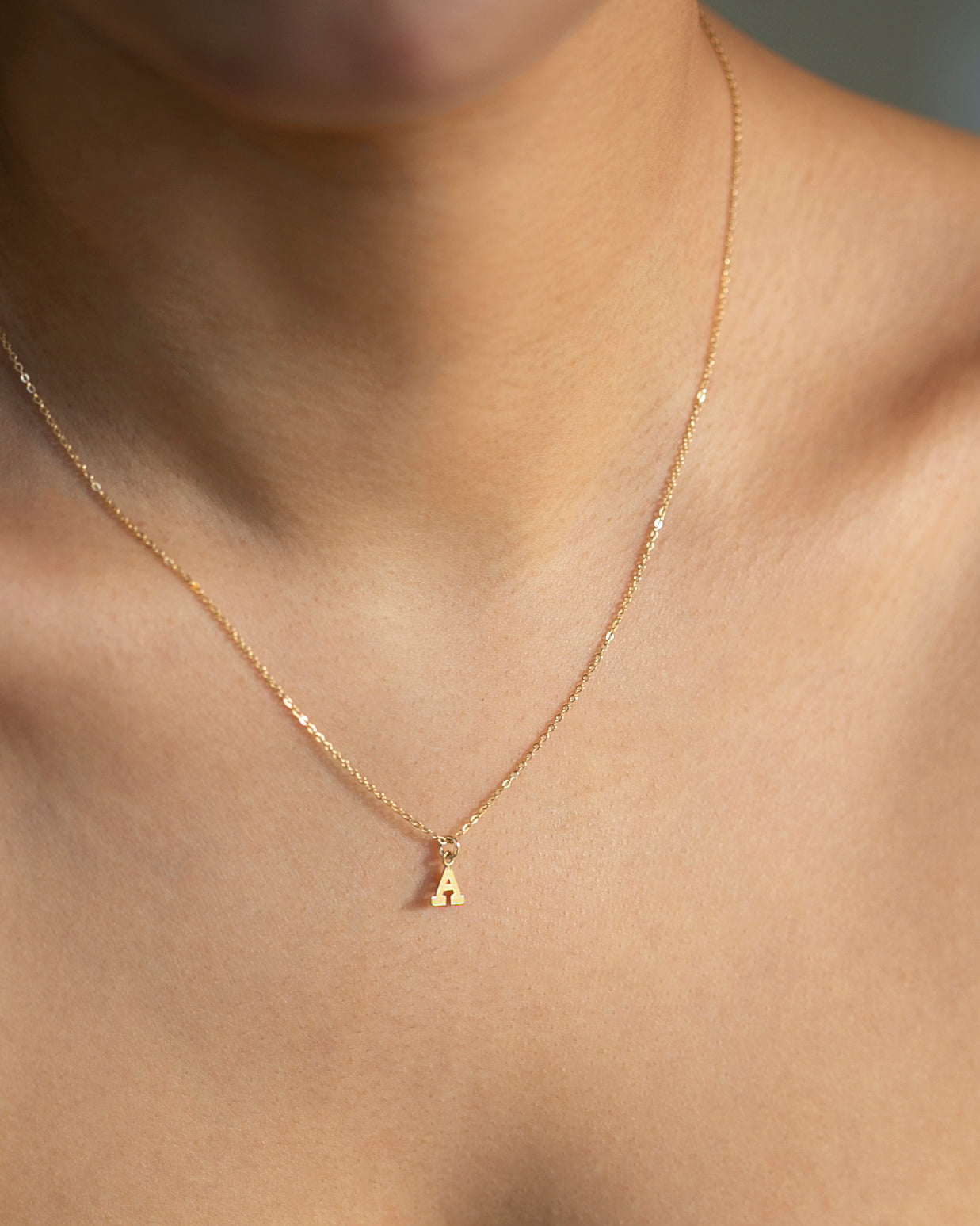 Mini initial necklace, perfect for adding a personal touch to any outfit.
Dainty Initial Necklace - Perfect wearing alone or layering with your favorite necklaces.