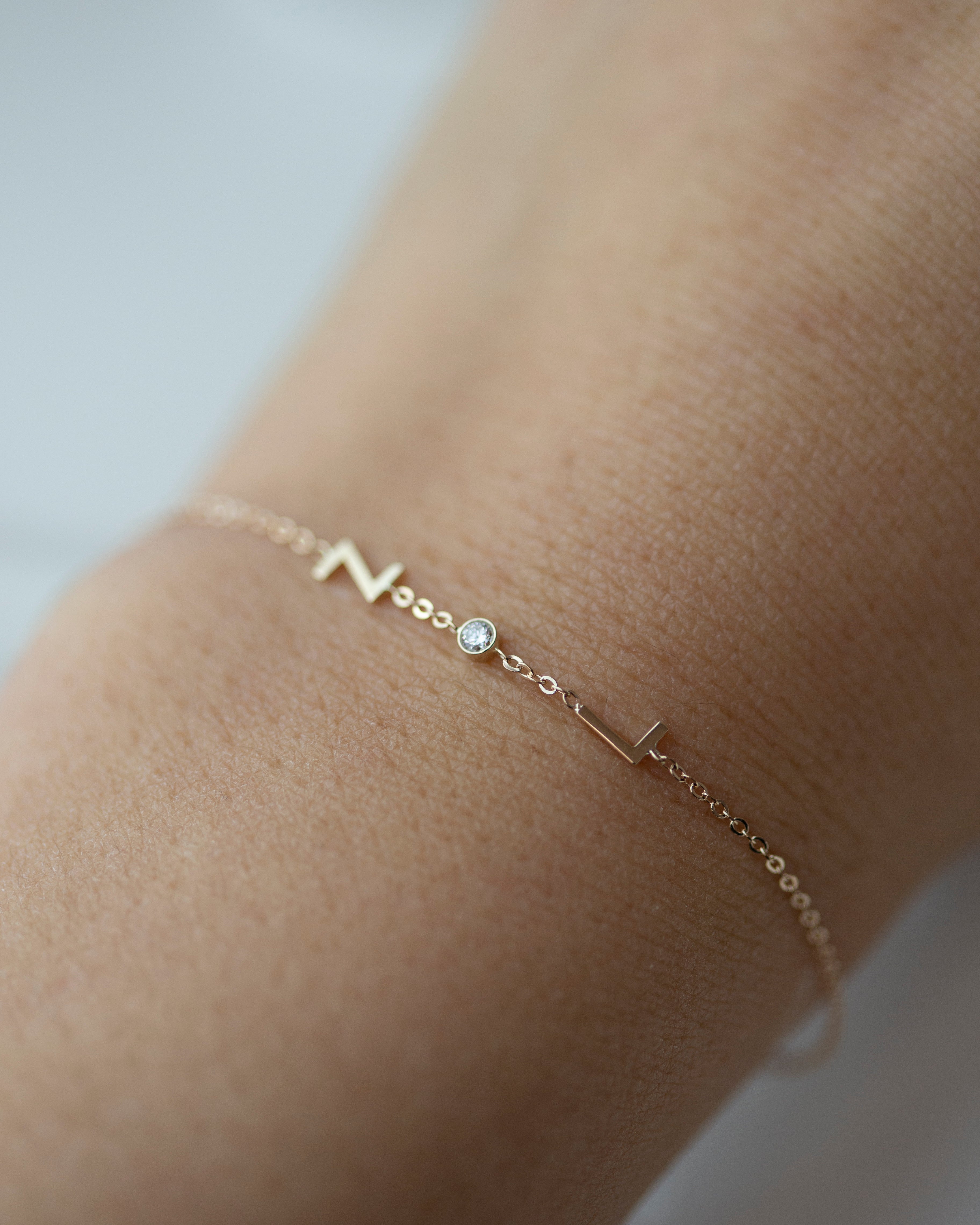 Personalized 14k solid gold initials bracelet with genuine diamond.

Simple, minimalist everyday bracelet with a little sparkle
Perfect wearing alone or layering with your favorite bracelets.