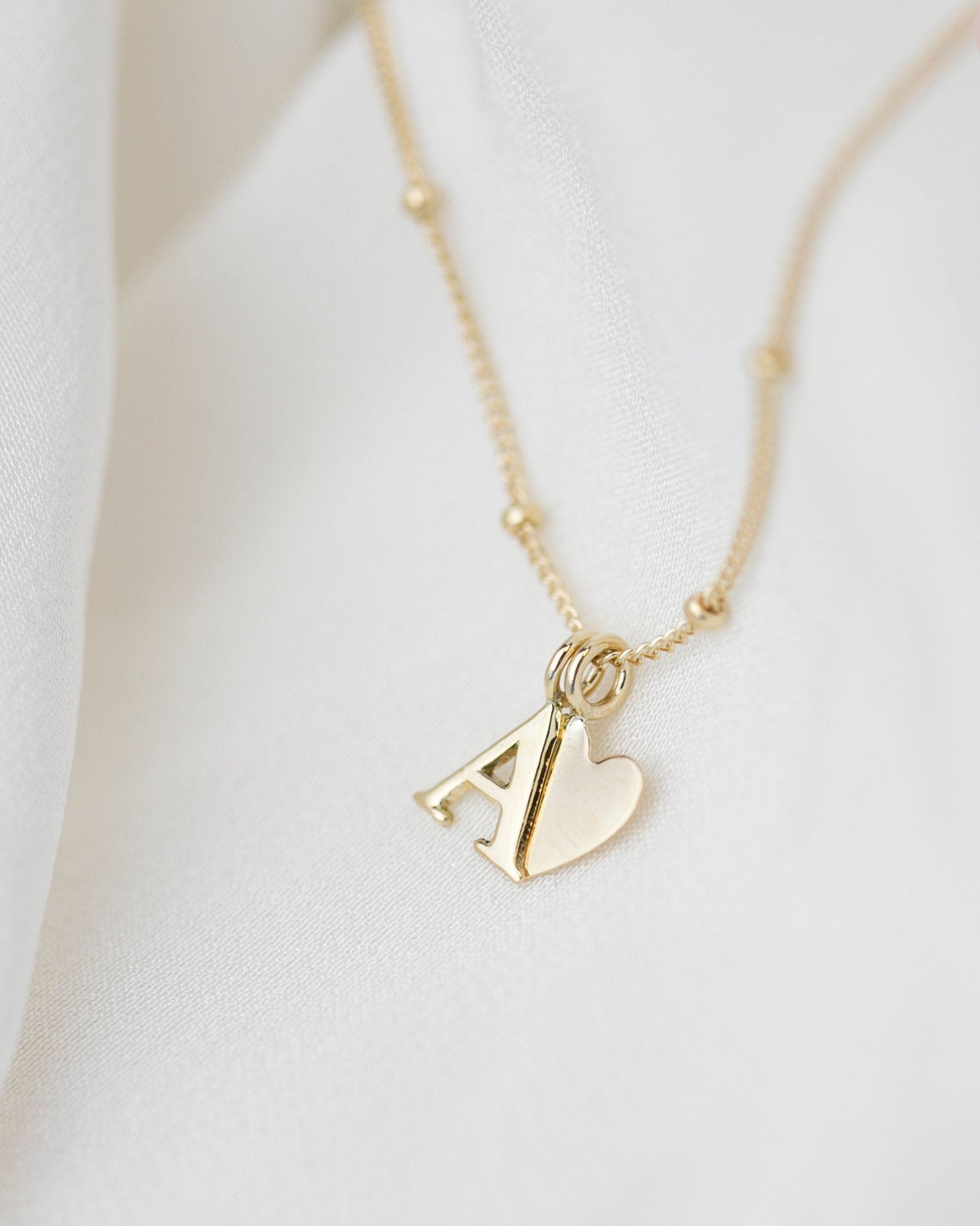Personalized 14k solid gold initials necklace with beautiful beaded chain.Simple, minimalist everyday necklace.
Perfect wearing alone or layering with your favorite necklaces.
