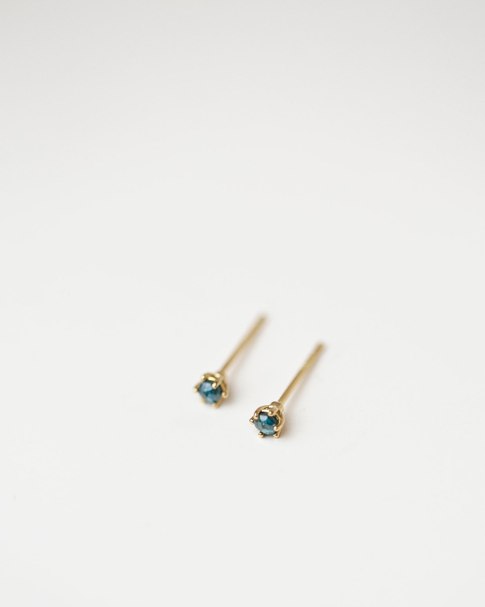 Gold Blue Rough Cut Diamond Solitaire Stud Earrings in 14k Gold.
