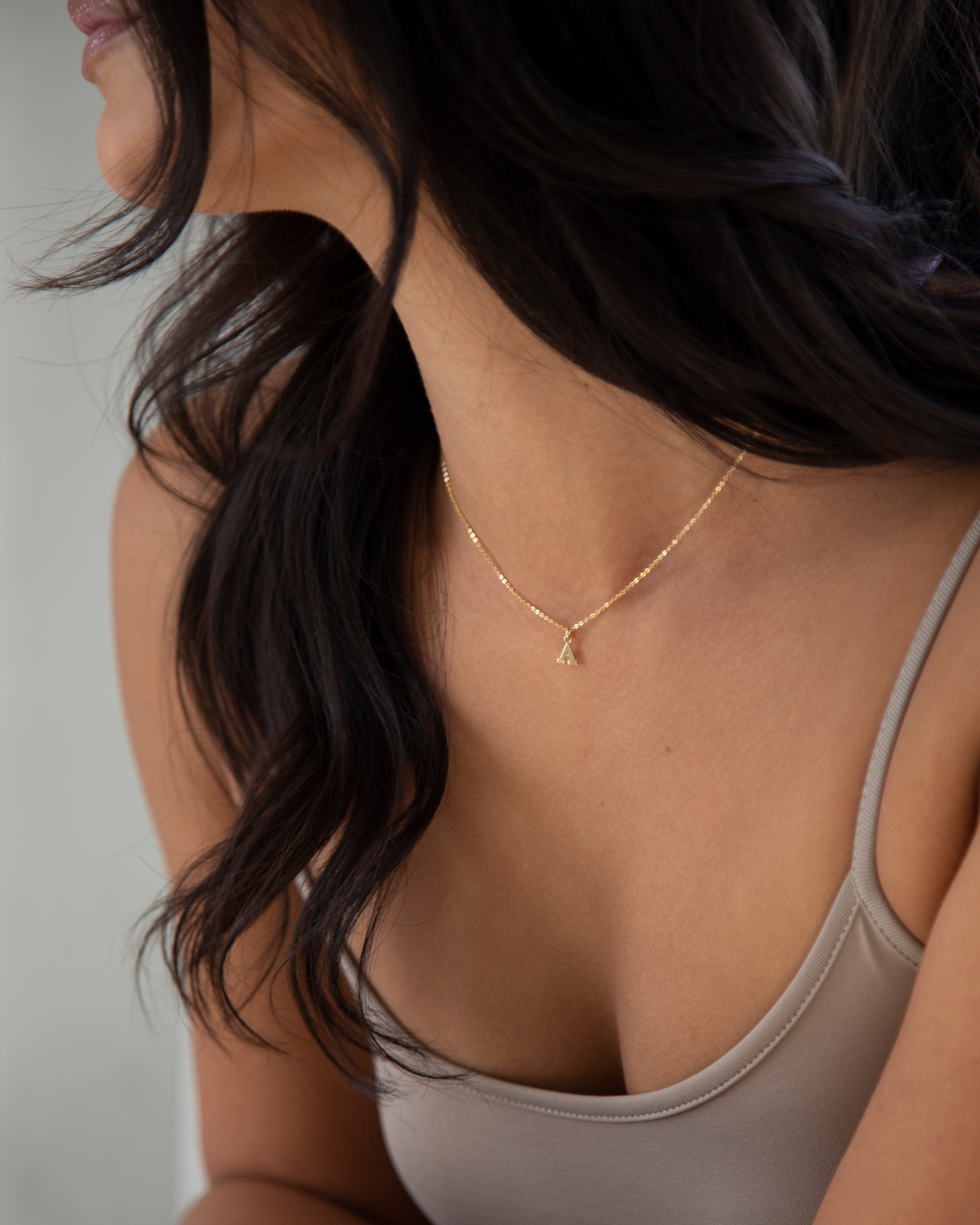 Mini initial necklace, perfect for adding a personal touch to any outfit.
Dainty Initial Necklace - Perfect wearing alone or layering with your favorite necklaces.

Super dainty &amp; fun.