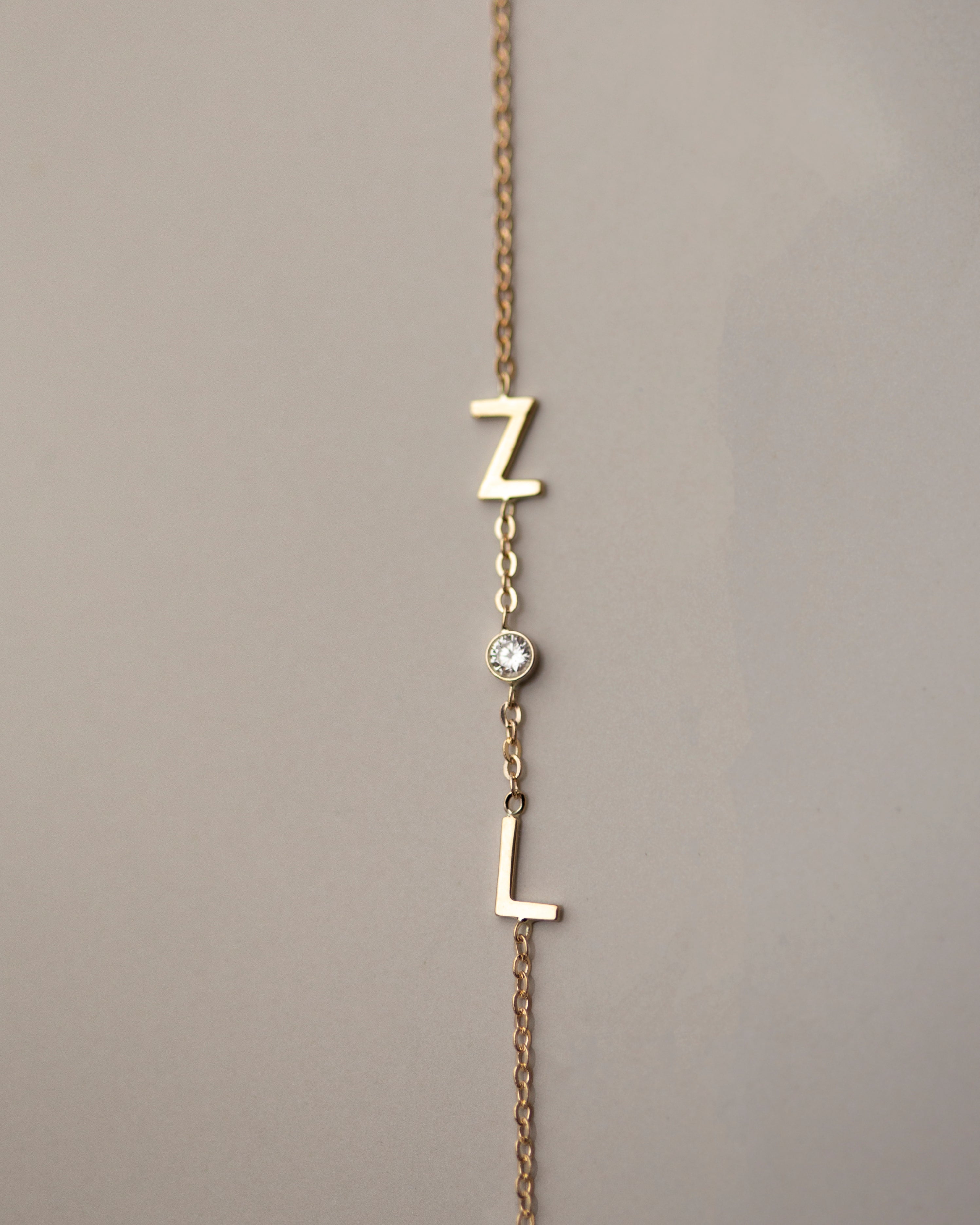 Personalized 14k solid gold initials bracelet with genuine diamond.