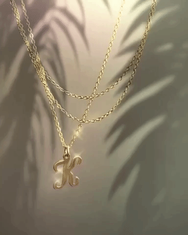 Cursive Letter Charm Necklace. Perfect wearing alone or layering with your favorite necklaces.