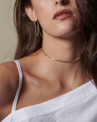 Indulge in the stunning elegance of our Coin Disc Choker, perfect for both a standalone piece or layered with other necklaces for a rich and bohemian look.
