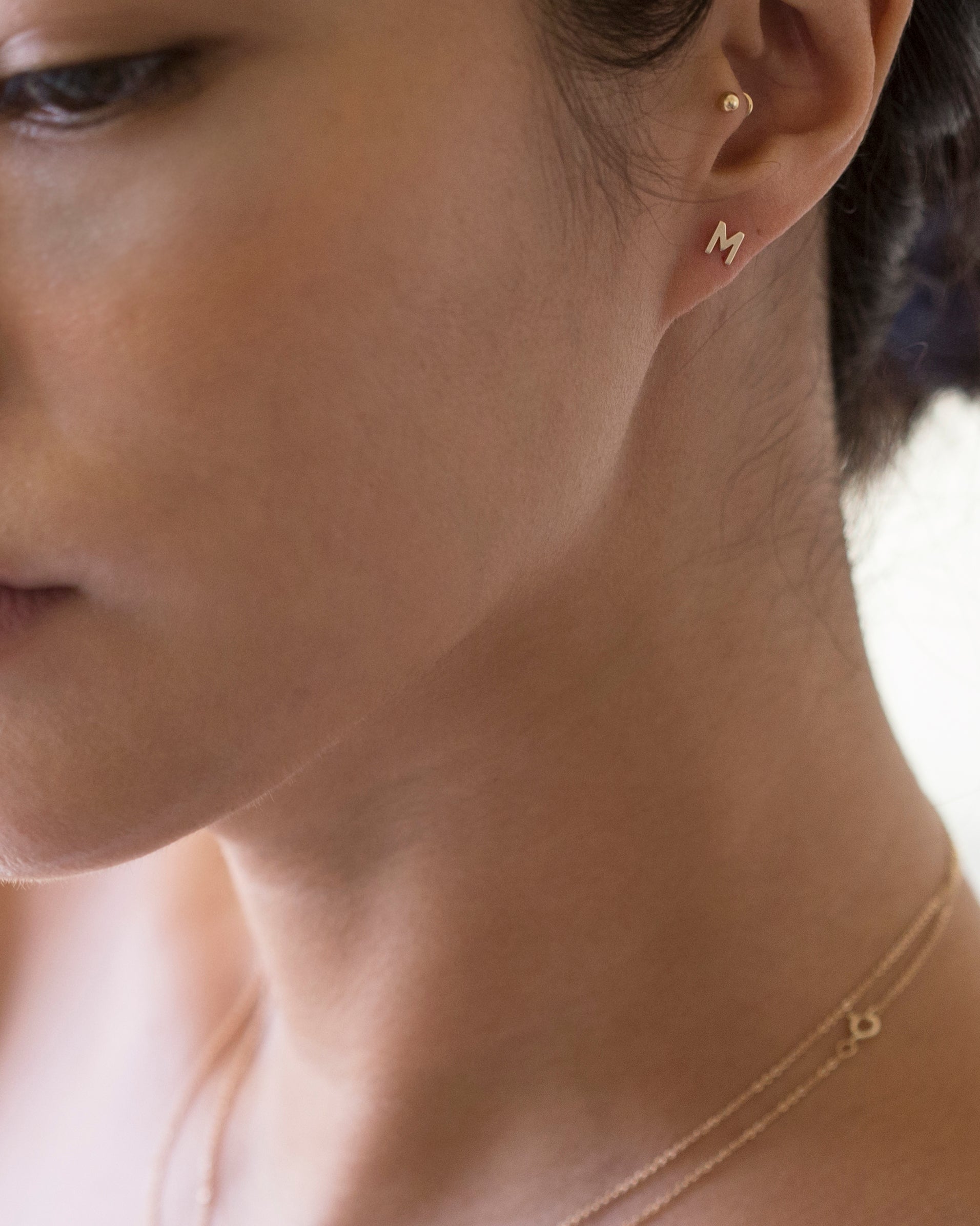 14K Initial stud Earrings - Enhance your style with a touch of sophistication and elegance using our 14K Solid Gold Initial Stud Earrings. Show off your initial and elevate your look with this exquisite accessory. Can be worn alone or paired with other earrings to create a stylish ear stack.