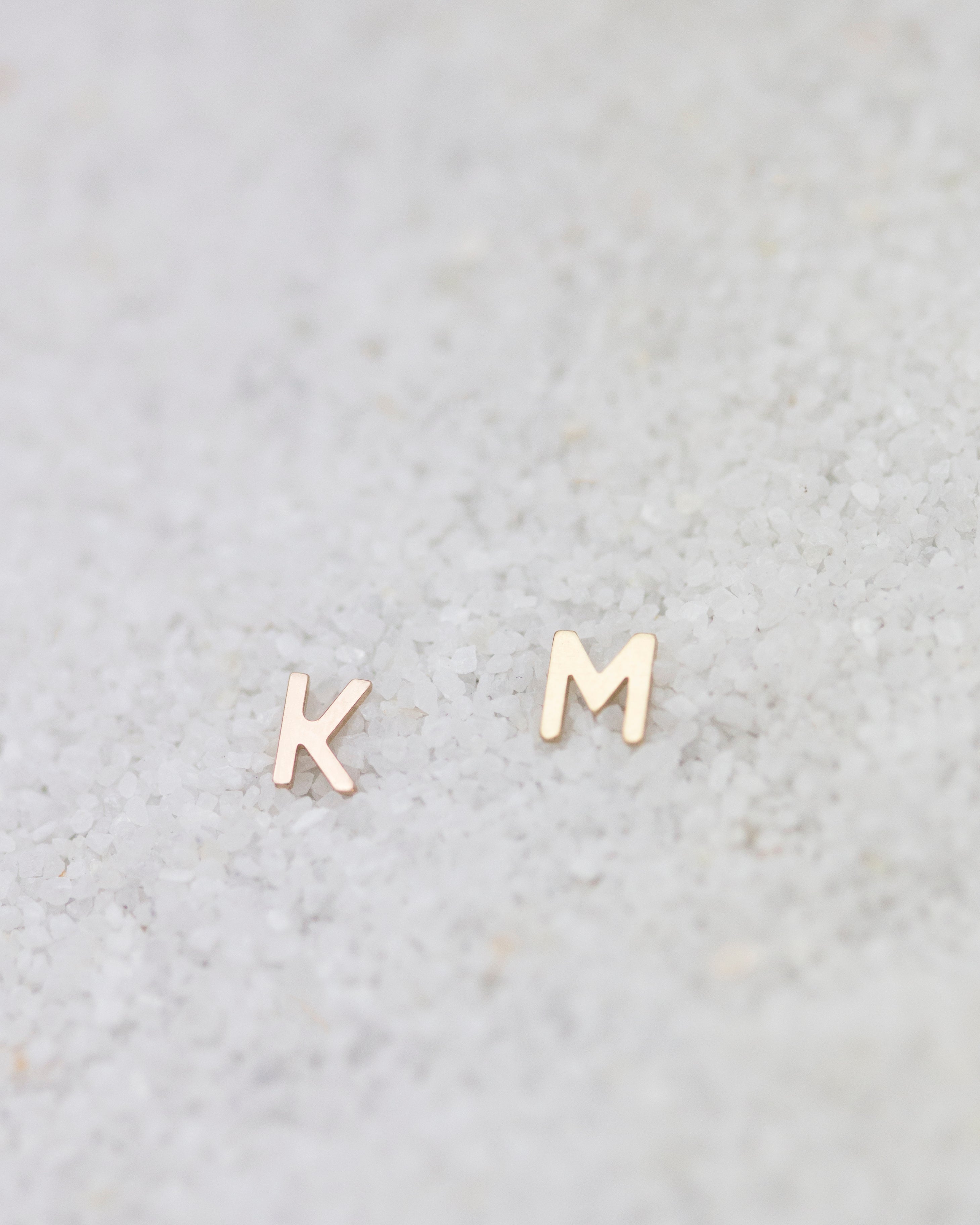 14K Initial stud Earrings - Enhance your style with a touch of sophistication and elegance using our 14K Solid Gold Initial Stud Earrings. Show off your initial and elevate your look with this exquisite accessory. Can be worn alone or paired with other earrings to create a stylish ear stack.