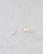 14K Initial stud Earrings - Enhance your style with a touch of sophistication and elegance using our 14K Solid Gold Initial Stud Earrings. Show off your initial and elevate your look with this exquisite accessory. Can be worn alone or paired with other earrings to create a stylish ear stack.