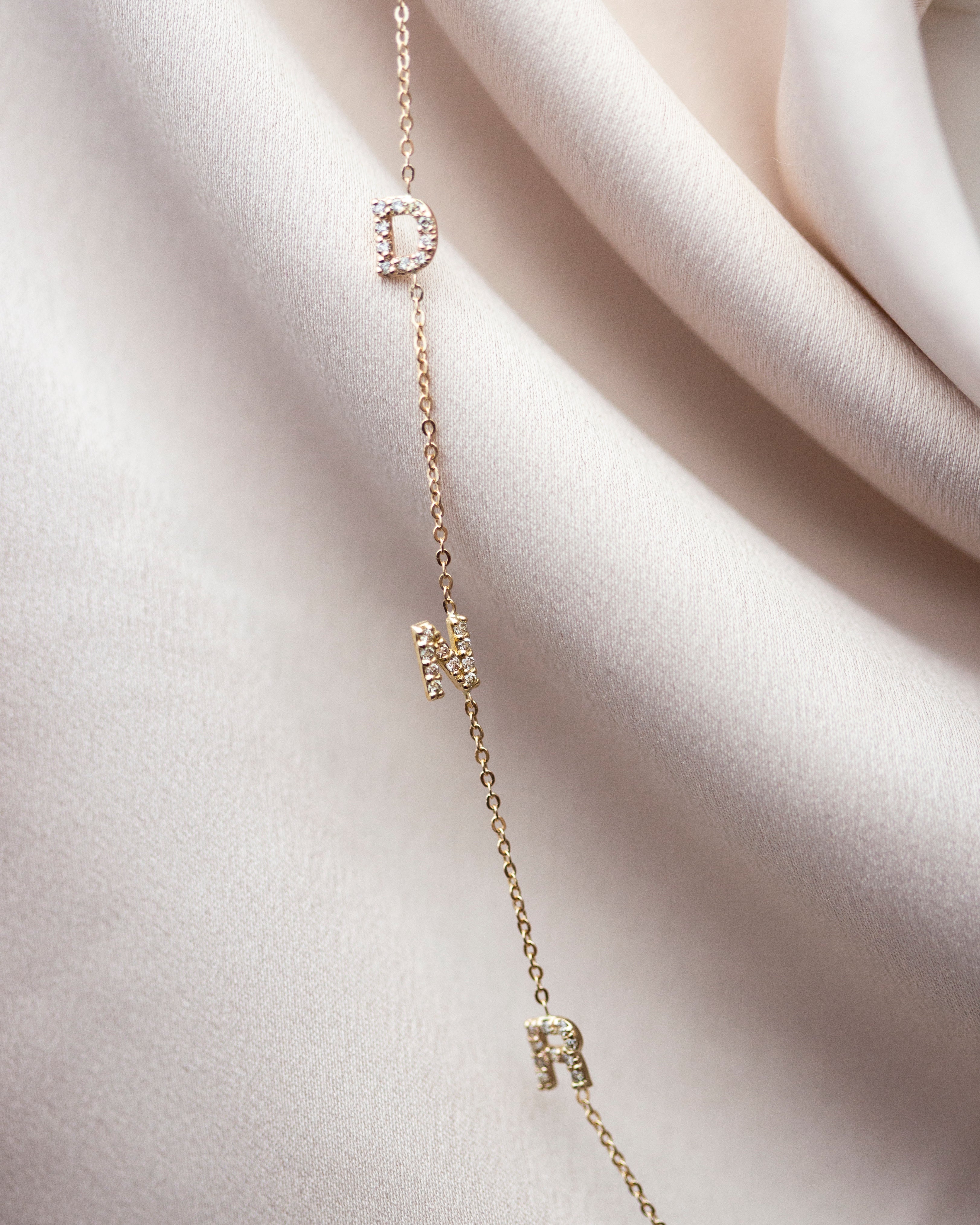 Personalized Asymmetrical 14k solid gold initials necklace. 