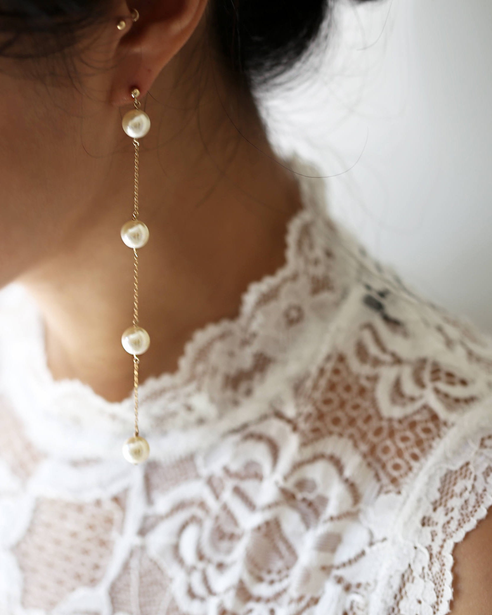 Pearl Drop Earrings | Pearl Long Dangle Earrings

Elegant drop earring featuring Swarovski pearl stations with a
post earrings and backings

Perfect bridesmaids gift or for bridal jewelry