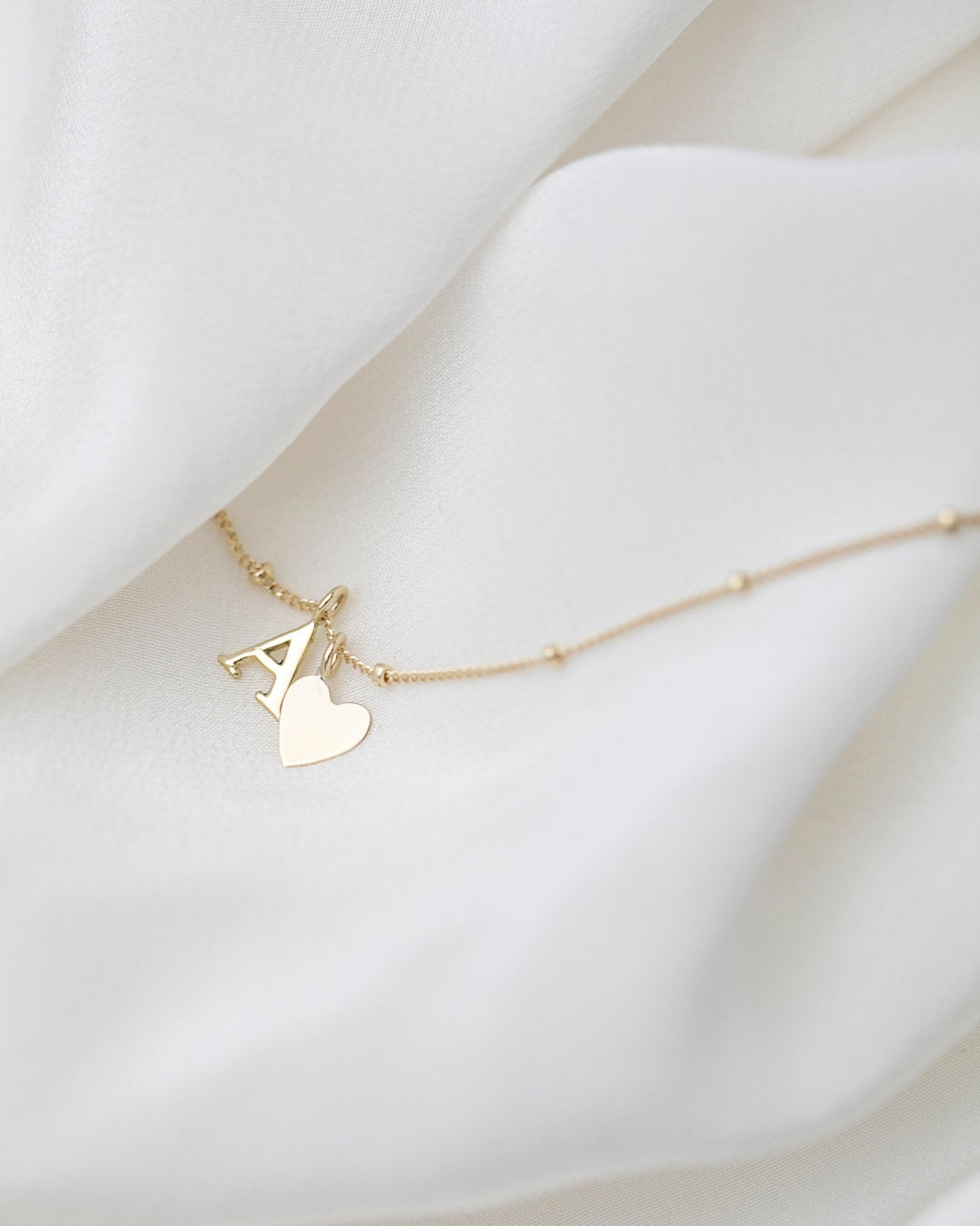 Personalized 14k solid gold initials necklace with beautiful beaded chain.Simple, minimalist everyday necklace.
Perfect wearing alone or layering with your favorite necklaces.