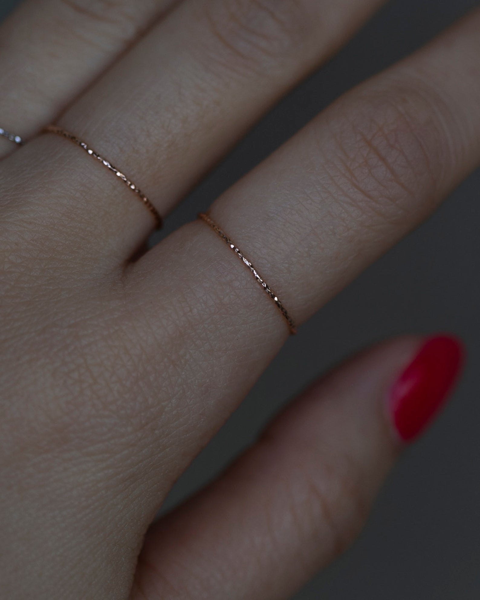 Crafted from 14k gold and featuring a diamond-cut design, these stacking rings offer a dainty and simplistic look that is perfect for everyday wear.