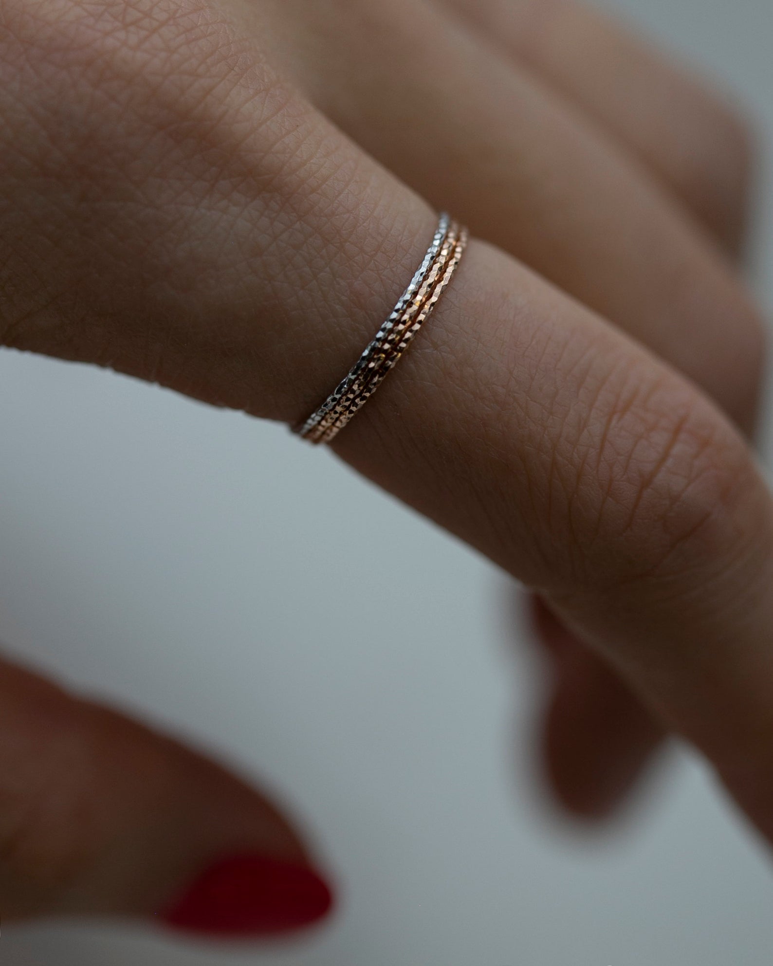Crafted from 14k gold and featuring a diamond-cut design, these stacking rings offer a dainty and simplistic look that is perfect for everyday wear.