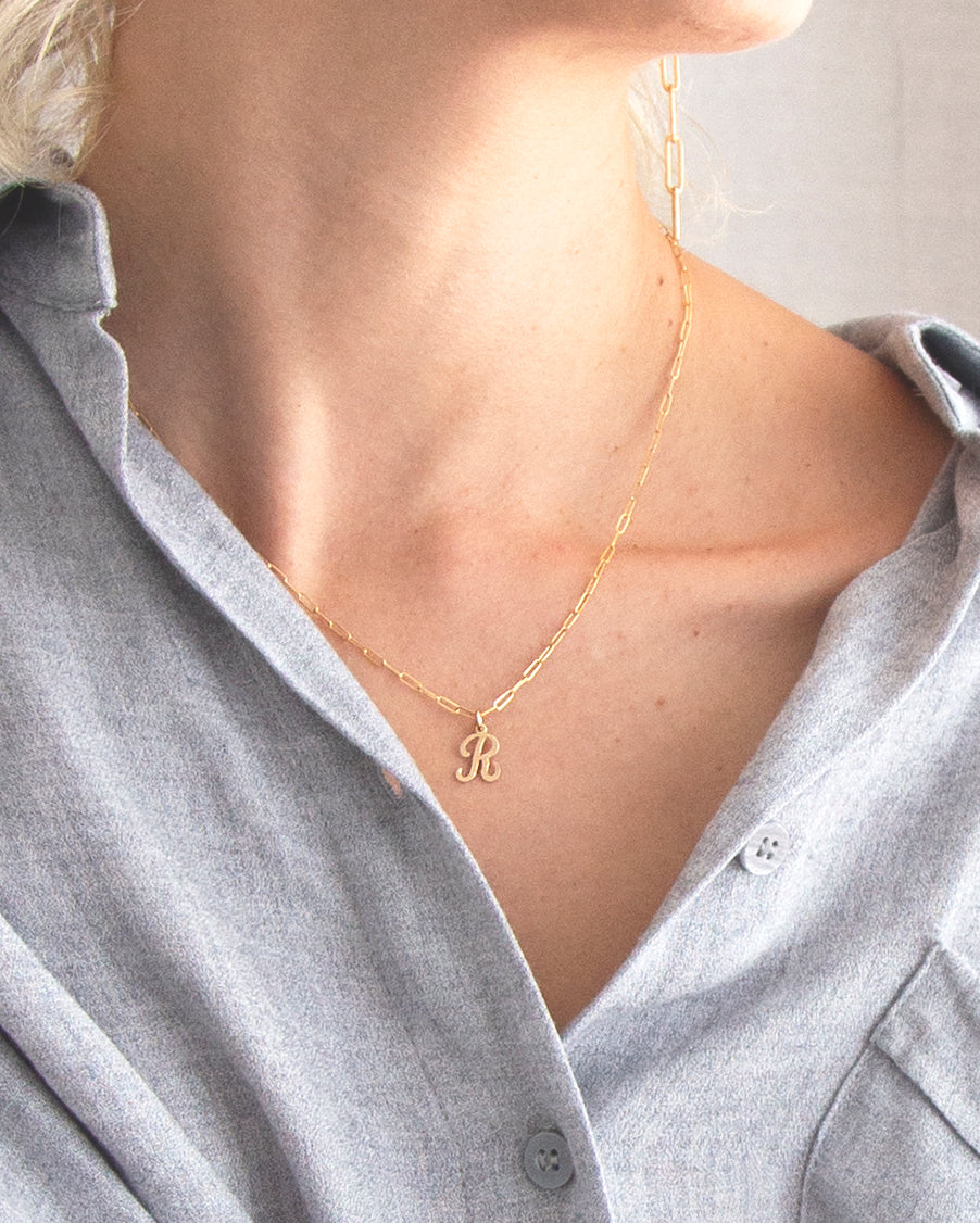 Cursive Letter Charm Necklace. Perfect wearing alone or layering with your favorite necklaces.