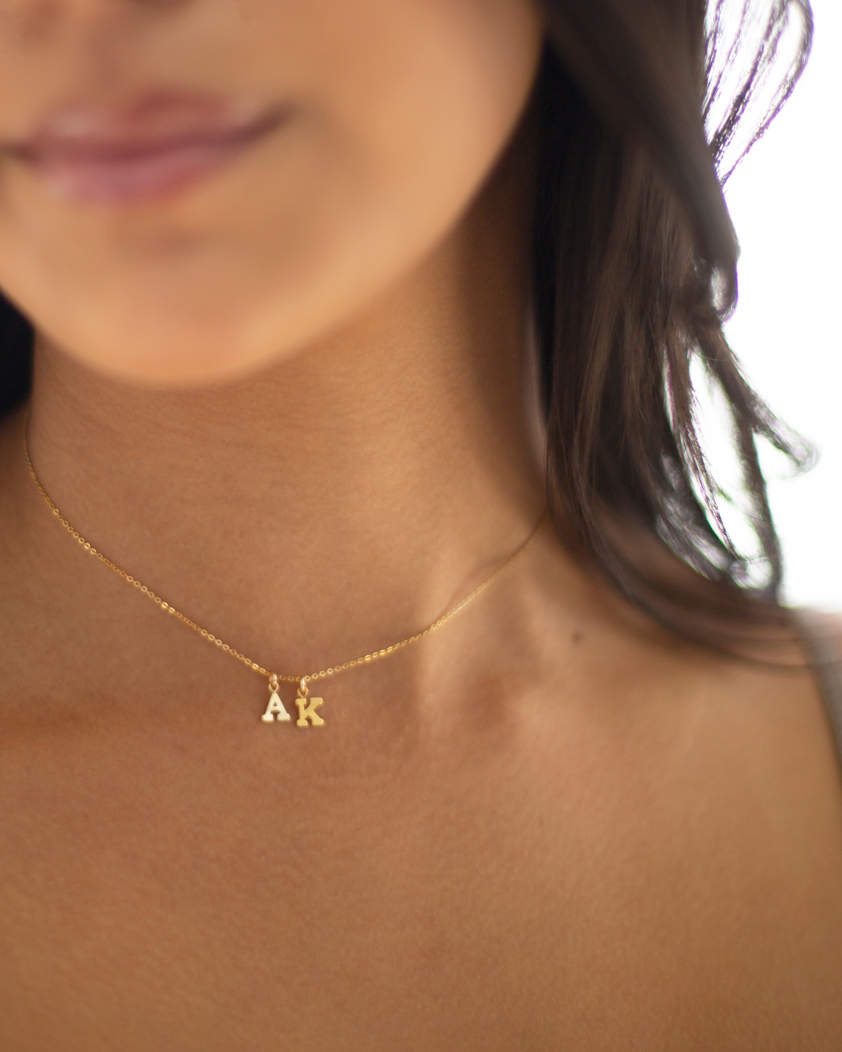 Mini initial necklace, perfect for adding a personal touch to any outfit.
Dainty Initial Necklace - Perfect wearing alone or layering with your favorite necklaces.

Super dainty &amp; fun.